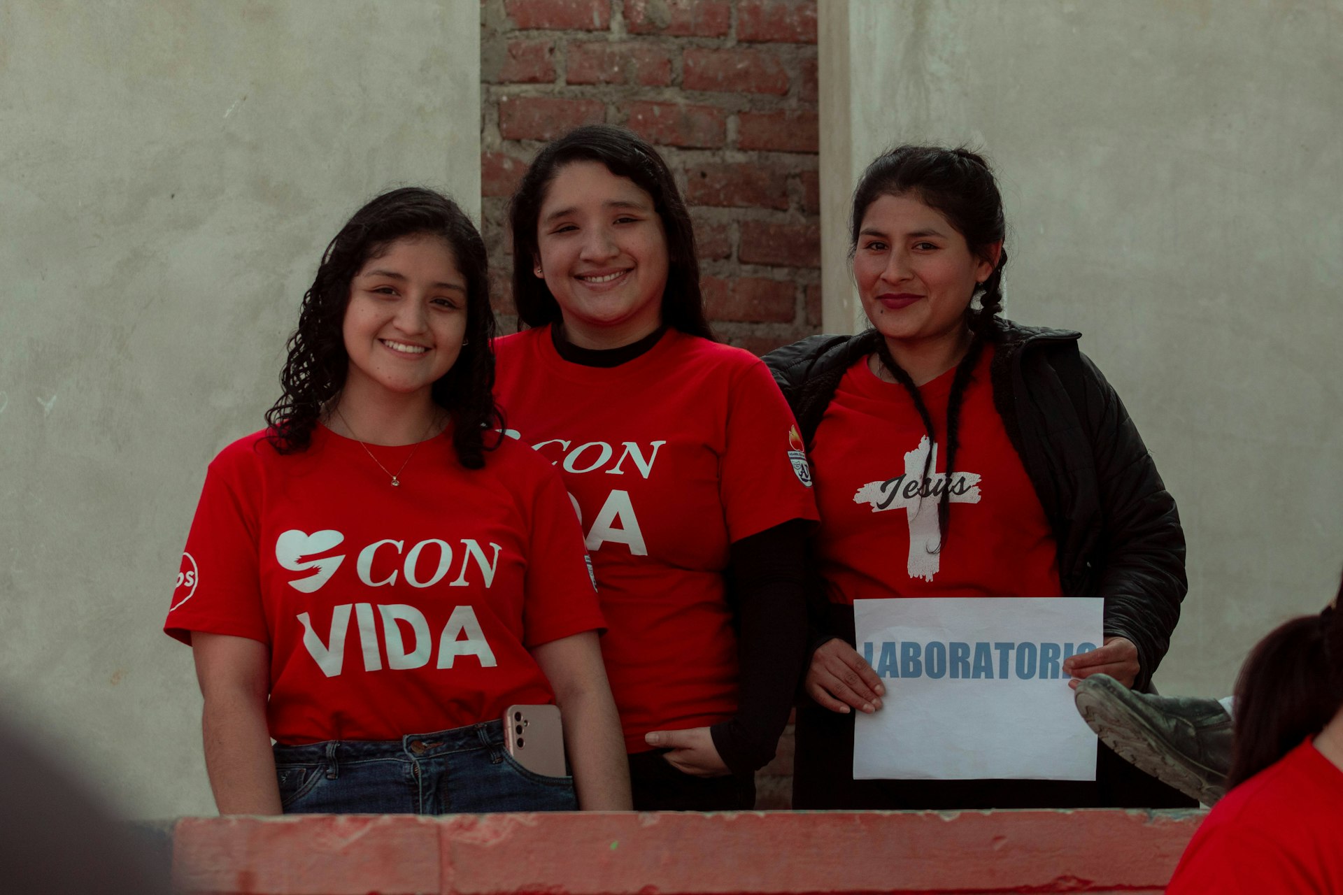 A group of women standing next to each other